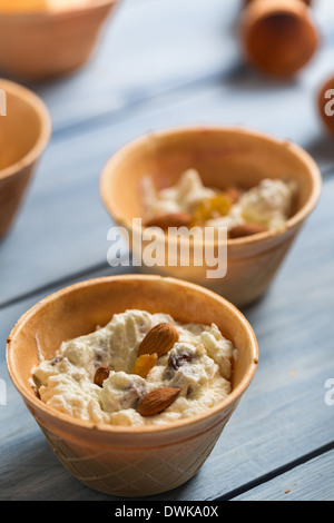 Preparation of nut ice cream in a wafer Stock Photo