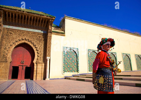 Water Carrier in from of Mausoleum of Moulay Ismail, Meknes, Morocco, North Africa, Africa Stock Photo