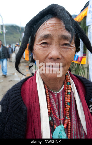 Momba tribeswoman wearing traditional five peak yak's wool hat and turquoise jewellery, Tawang, Arunachal Pradesh, India Stock Photo