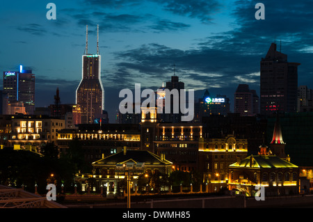 The skyline along the Bund in Shanghai, China, at sunset. Stock Photo