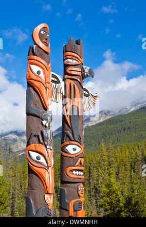 Traditional Canadian native Totem poles at Sunwapta Falls Resort, Jasper National Park, UNESCO Site, Alberta, Canada Stock Photo