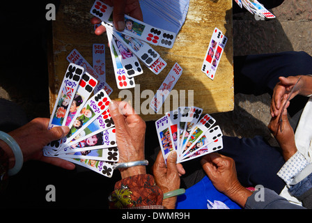 Naxi women playing a local game of cards, Lijiang, Yunnan, China, Asia Stock Photo