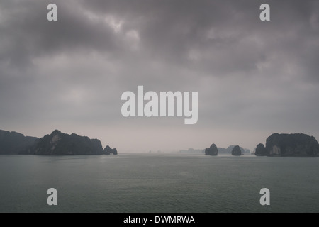 Ha long Bay in Vietnam in the mist Stock Photo