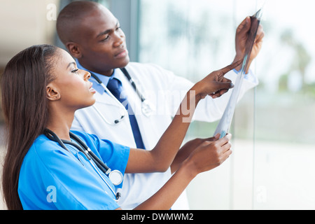 African doctors looking at patient's x-ray at hospital Stock Photo