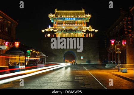 Reconstructed 'old' town of Shanhaiguan at night. Illuminated streets with drum tower in the middle. Hebei Province, China. Stock Photo