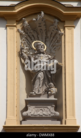Saint Augustine on the facade of St. Augustine's Church in Wurzburg Stock Photo