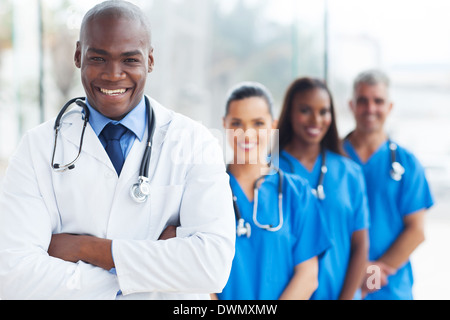 confident African medical doctor and colleagues portrait in hospital Stock Photo
