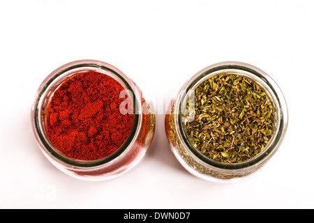 Oregano and paprika powder in a glass pot Stock Photo