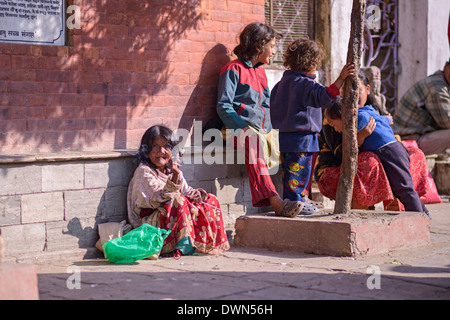 Beggar in the streets of Kathmandu on Bhaktapur Durbar Square Stock Photo