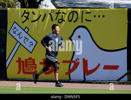 Tampa, Florida, USA. 9th Mar, 2014. Masahiro Tanaka (Yankees) MLB : Masahiro Tanaka of the New York Yankees jogs past a Japanese advertisement during the New York Yankees spring training baseball camp at George M. Steinbrenner Field in Tampa, Florida, United States . © AFLO/Alamy Live News Stock Photo