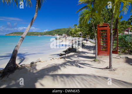 Beach and red telephone box, Dickenson Bay, St. Georges, Antigua, Leeward Islands, West Indies, Caribbean, Central America Stock Photo