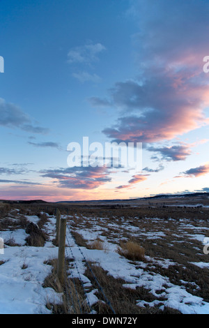 A pink and blue sky sunset on the prairie in Alberta, Canada Stock Photo