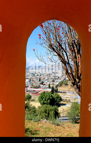 Looking down on Cholula through an archway on top of the Great Pyramid, Cholula, Puebla, Mexico Stock Photo