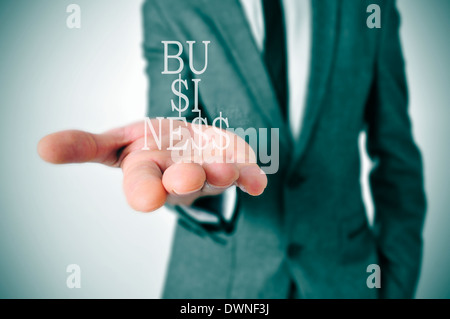 a businessman showing the word business in his hand written with dollar signs instead of esses Stock Photo