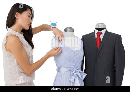 Female fashion designer and mannequins Stock Photo