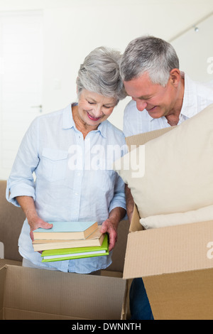 Happy senior couple moving into new home Stock Photo