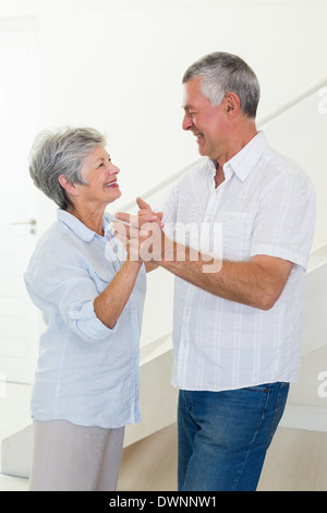 Happy senior couple dancing together Stock Photo