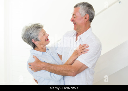 Happy senior couple dancing together Stock Photo