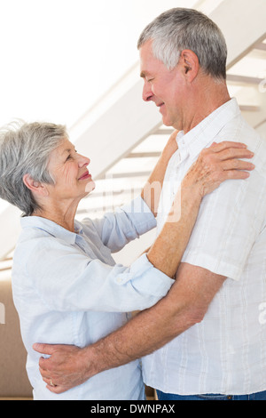 Affectionate senior couple dancing together Stock Photo