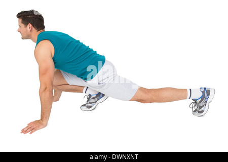 Side view of a fit man doing stretching exercise Stock Photo