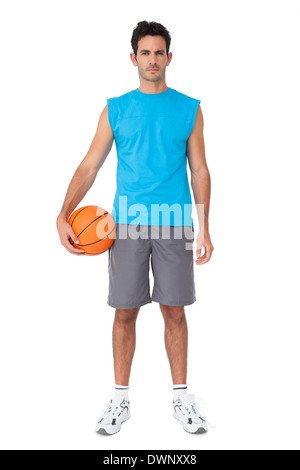 Serious basketball player with ball Stock Photo