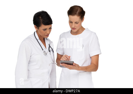 Two female doctors using digital tablet Stock Photo