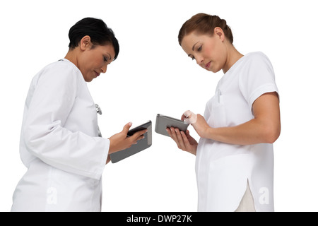 Two female doctors using digital tablets Stock Photo