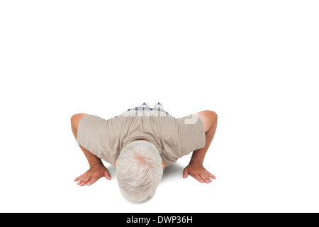 Senior man doing push ups Stock Photo