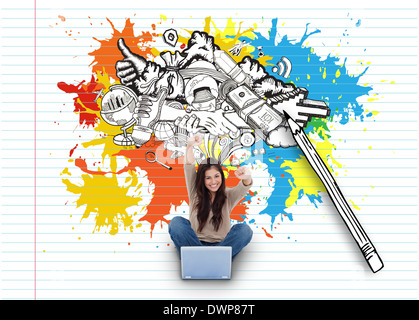 Cheering girl using laptop with doodles Stock Photo