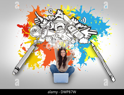 Cheering girl using laptop with doodles Stock Photo