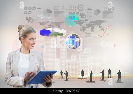 Blonde businesswoman using tablet pc with interface Stock Photo