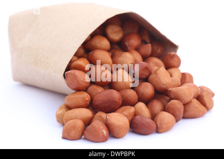 Peanut with a paper pack over white background Stock Photo