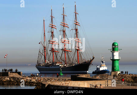 Rostock-Warnemuende, Germany. 12th Mar, 2014. The Russian four-masted steel barque 'Sedov' sails into the Baltic sea harbour of Rostock-Warnemuende, Germany, 12 March 2014. With a length of 117, 5 meters the 93-year old sailing ship is considered to be the worlds largest sail training vessel. Until 15 March the Sedov will lie in harbour in Warnemuende and will be open to visitors. Photo: BERND WUESTNECK/dpa/Alamy Live News Stock Photo