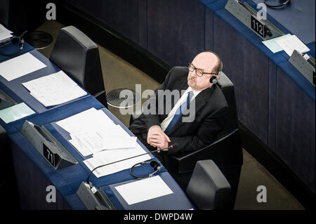 Strasbourg, France. 12 March 2014. MEP Ryszard Legutko listens to debate on crisis situation in Ukraine at European Parliament headquarters in Strasbourg, France on 12.03.2014 Members of European Parliament debate on Russian invasion of Crimea. The hemicycle was almost empty. Credit:  dpa picture alliance/Alamy Live News Stock Photo