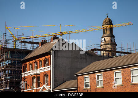 Manchester, UK 12th March, 2014.   City construction boom near St Phillips Church and Manchester and Salford Savings Bank building.    Mantis Self-erecting tower cranes being used in assembly 109 bed student accommodation block in Chapel Street, Salford. Bardsley construction have been awarded the contract to build the 5 storey brick clad steel development, a £3.45m student scheme, with X1 Developments. Stock Photo