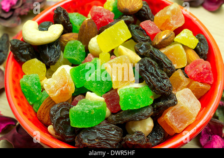 Mixture of dried fruits and nuts in a red cup Stock Photo