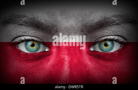 Human face painted with flag of Poland Stock Photo