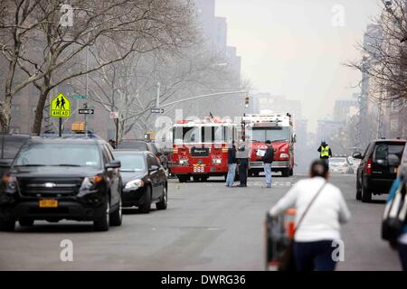 New York, USA. 12th Mar, 2014. Firefighters work at the site of explosion in New York's East Harlem neighborhood, March 12, 2014. At least two people were killed and 18 others injured when two residential buildings collapsed in an explosion in New York's East Harlem neighborhood on Wednesday, authorities said. Credit:  Wu Rong/Xinhua/Alamy Live News Stock Photo