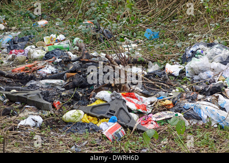 Fly Tipped Rubbish on Waste Ground, UK Stock Photo