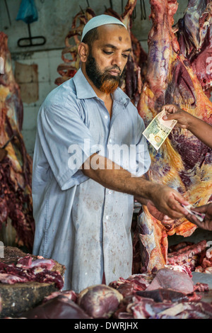 Butcher in Kandy food market Sri Lanka Stock Photo