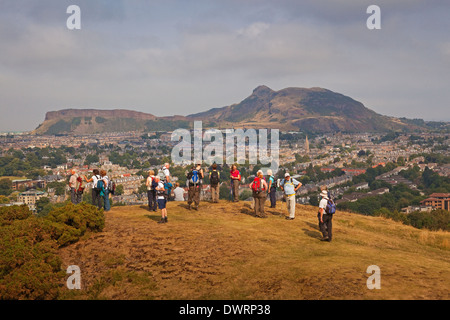 Walkers on Blackford Hill, Edinburgh. Arthur's Seat is in the background. Stock Photo