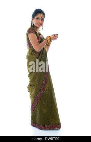 indian female in traditional clothes with lamp full body Stock Photo