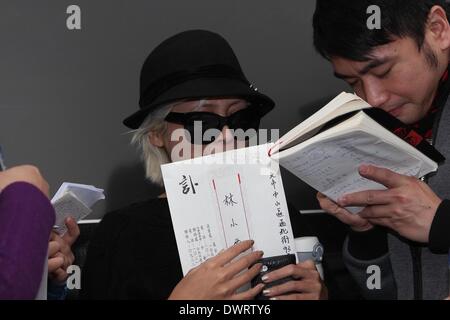 Funeral of the late singer Gao Lingfeng held in Taipei on Wednesday March 12, 2014.Gao Lingfeng`s son Baodi, ex-wife Jin Youzhuang, friend Zhang Fei, Wang Weizhong, Makiyo and Shino Lin present the funeral. Stock Photo