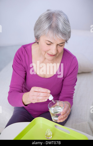 Herbal medicine, elderly person Stock Photo