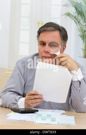 Man doing paperwork Stock Photo