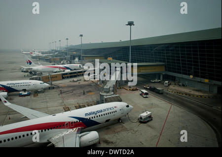 Kuala Lumpur, Malaysia. 13th Mar, 2014. The passenger planes of Malaysia Airlines are seen at the international airport of Kuala Lumpur, Malaysia, March 13, 2014. © He Jingjia/Xinhua/Alamy Live News Stock Photo