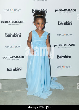 Young child modeling as celebrity for Toddlewood by Tricia Messeroux at Vogue Bambini petiteParade in New York Stock Photo