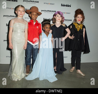 Young child modeling as celebrity for Toddlewood by Tricia Messeroux at Vogue Bambini petiteParade in New York Stock Photo