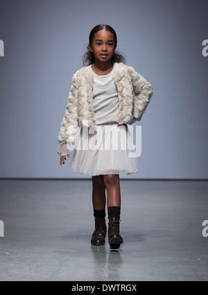 Girl walks runway for Imoga by Heajung Chung at Vogue Bambini petiteParade Kids Fashion Week in New York Stock Photo