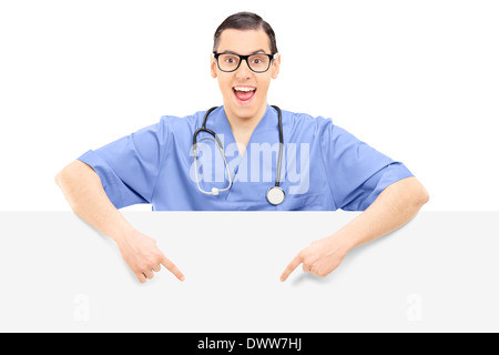 Doctor pointing on a blank panel Stock Photo